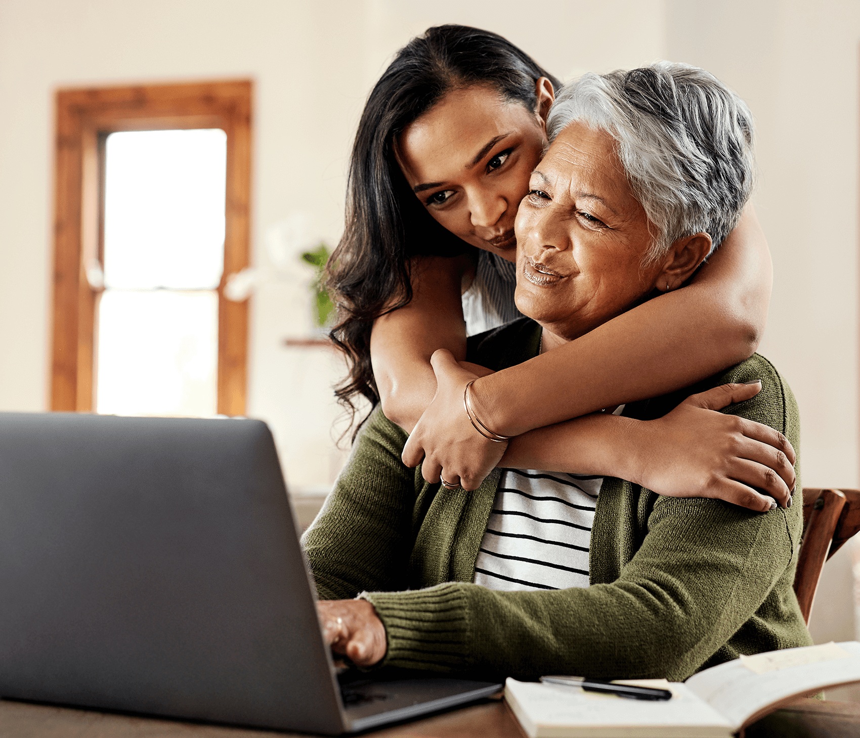 Mother and daughter using financial planning tools 